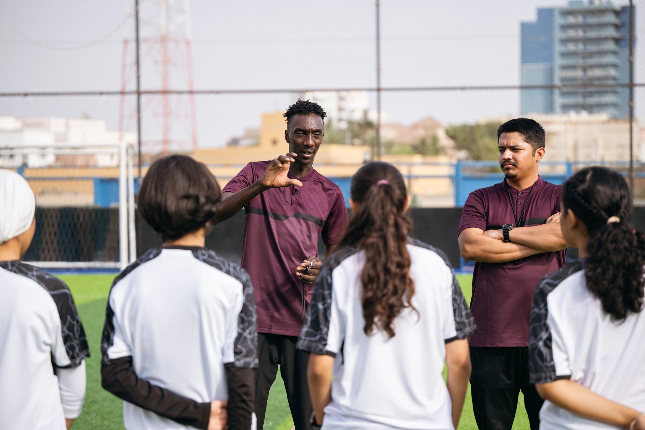 Coach speaking to athletes during training